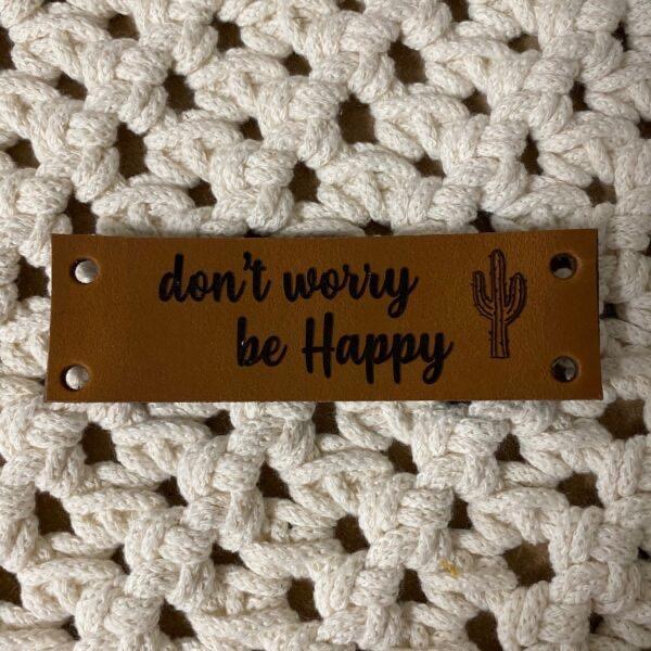 Leren_label_cognac__Don_t_worry__be_happy_